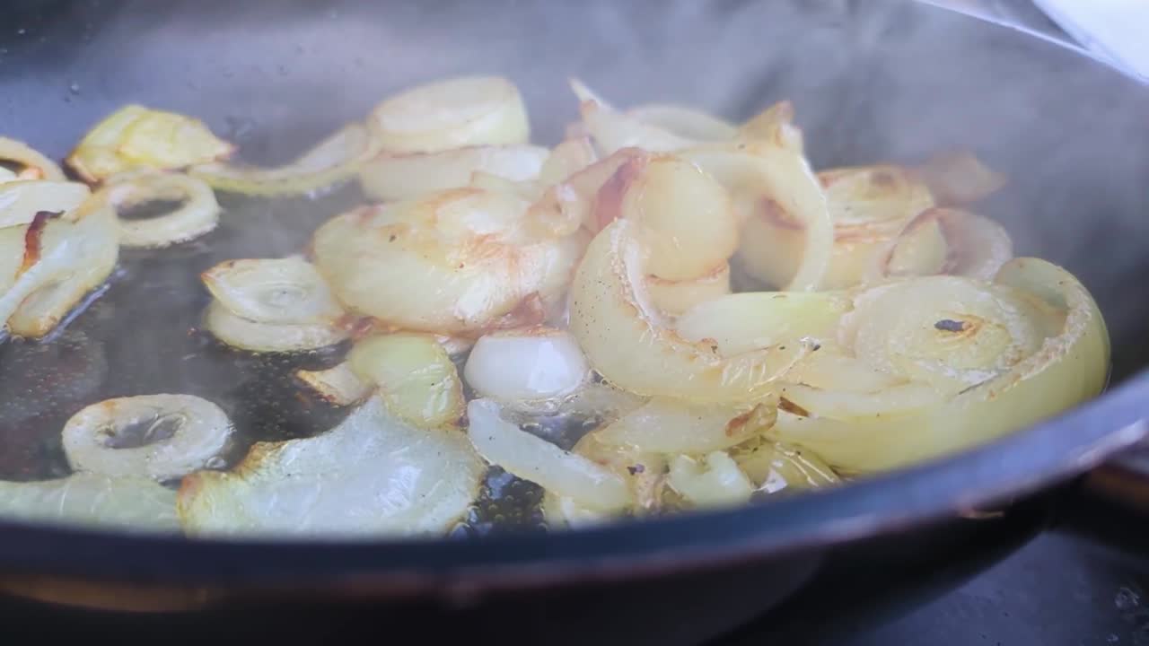 Slow Motion Chopped White Onions in Hot Pan with Oil