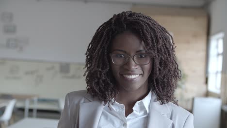 young african american businesswoman smiling at camera