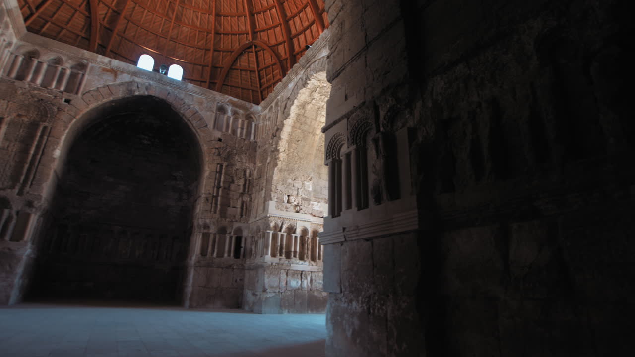 Umayyad Palace at Jabal Al Qal'a, the Citadel of Amman, Jordan. wide shot pan right, Umayyad palace hall from inside. 4K
