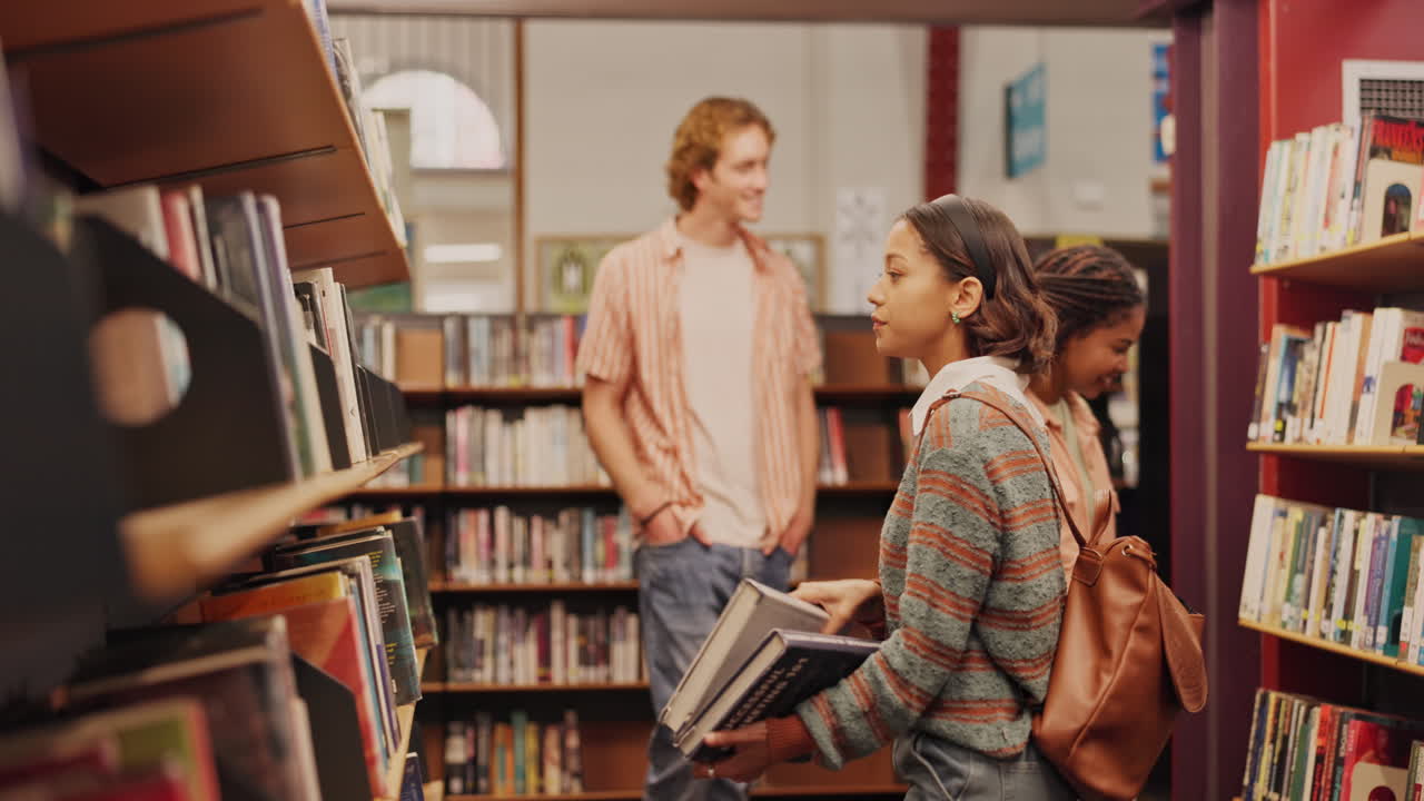 Students browsing books in a library
