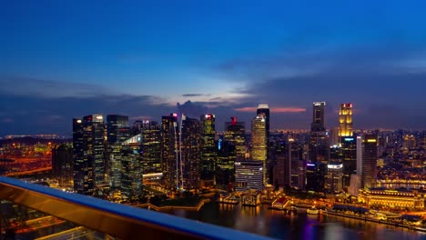 timelapse of marina bay sands in singapore transitioning from day to night, showcasing business skyscrapers and high-tech city vibes