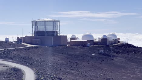 Cinematic panning shot of the Haleakala Observatory at the summit of Haleakala on the island of Maui in Hawai&#039;i