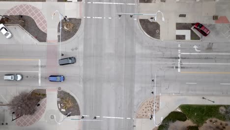 intersection with cars moving in downtown topeka, kansas with overhead drone video stable