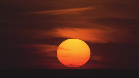 the bright sunset on a night cloud background. time lapse