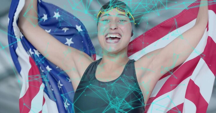 Nuotatrice che afferra e solleva la bandiera degli Stati Uniti mentre una rete color verde acqua anima la bandiera celebrando una vittoria sportiva