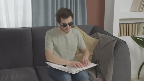 front view of caucasian young man touching a book