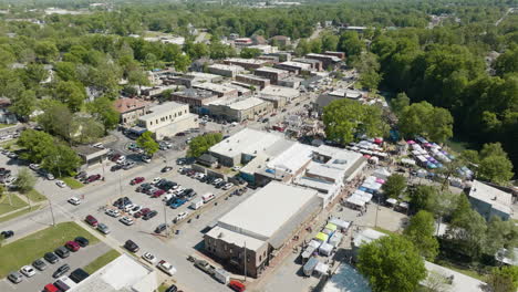 aerial view of city of siloam springs during dogwood festival in ar, usa - drone shot