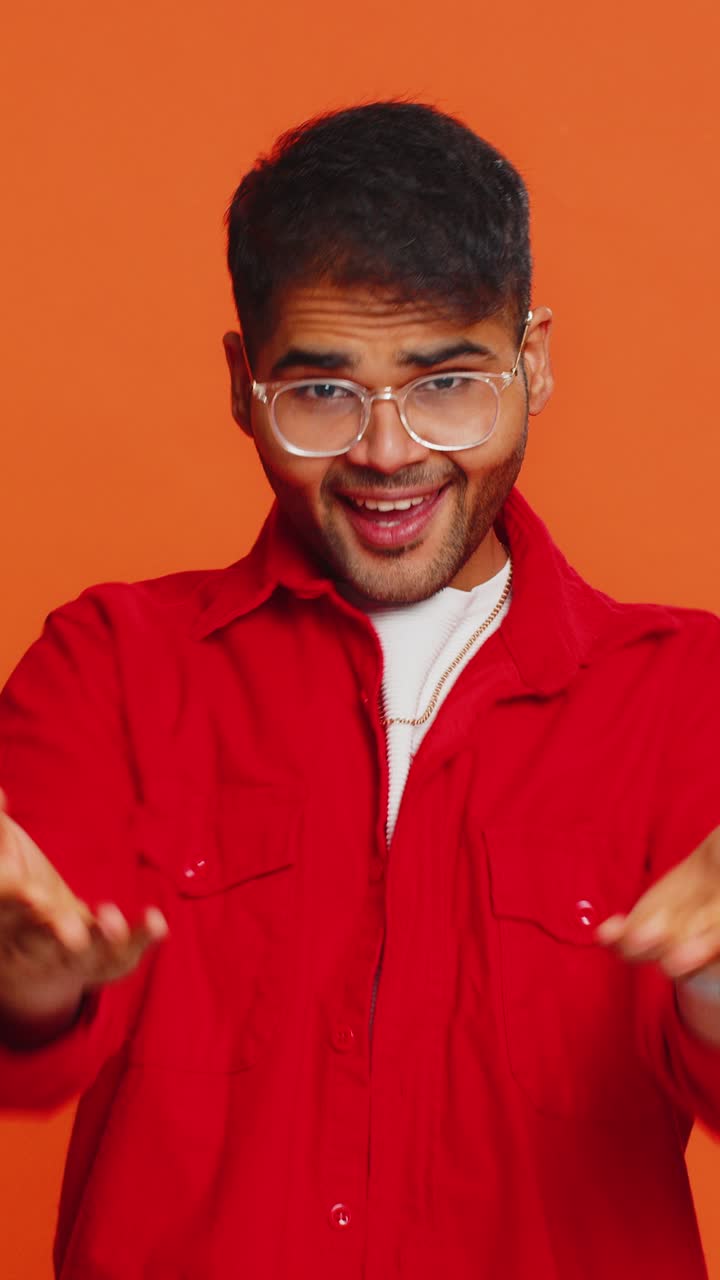 Indian man spread hands and give hug to you pleasant expression love feelings proud satisfied