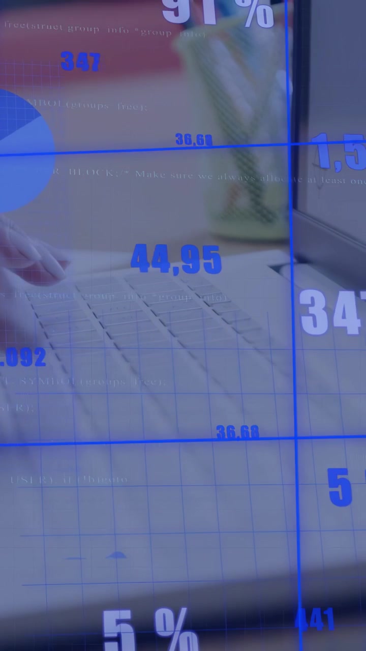 Vertical video: Female hands typing on laptop keyboard updating blue charts and metrics for finance