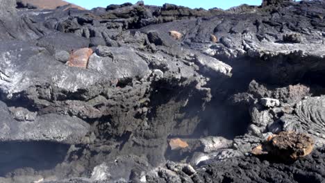 close-up shot of steaming hot volcanic rock