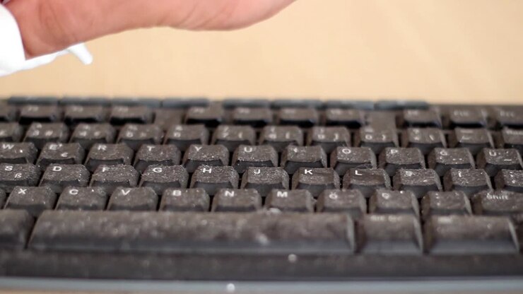 Fingers Cleaning Taking Care Of Laptop Keyboard