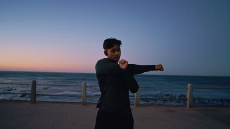 Stretching,-fitness-and-man-runner-at-beach