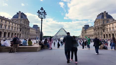 louvre pyramid museum square paris france tourist attraction busy during the day