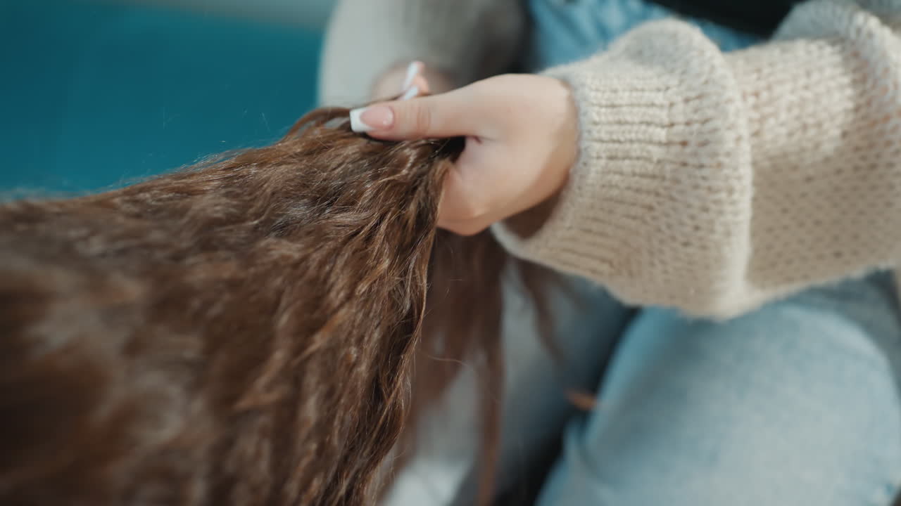 Hair Braiding Closeup, Stylist Weaving Hair With Focus, Caucasian Stylist Meticulously Creating Tight Braid Details, Closeup Of Hands Skillfully Weaving Long Hair Into Intricate Braid