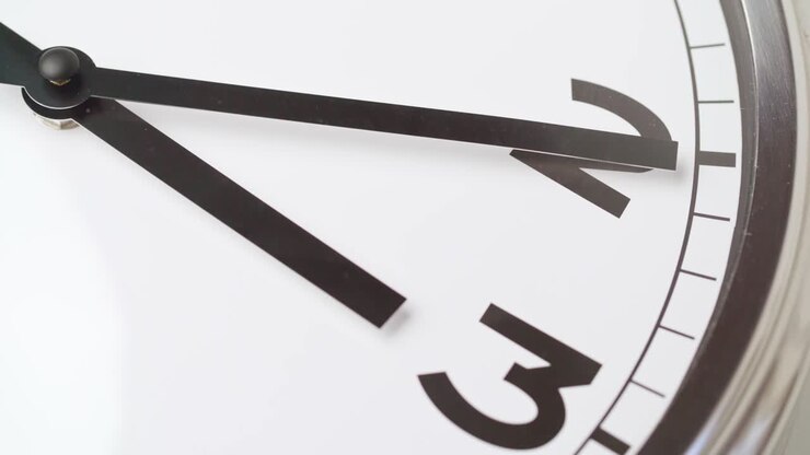 Close up video of clock face on wall