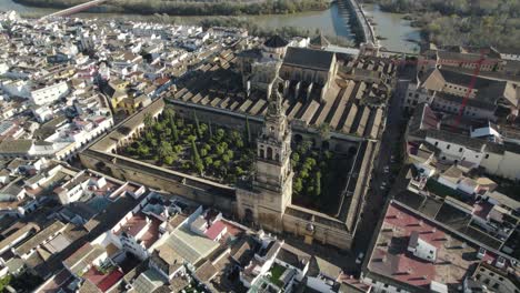 aerial tilt-up reveal of historic landmark mezquita-catedral de córdoba