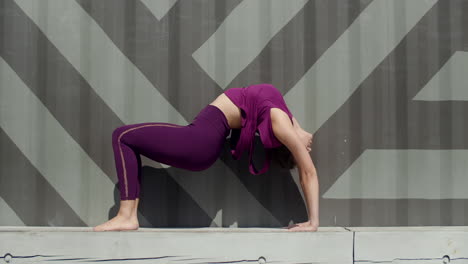 woman performing a backbend yoga pose