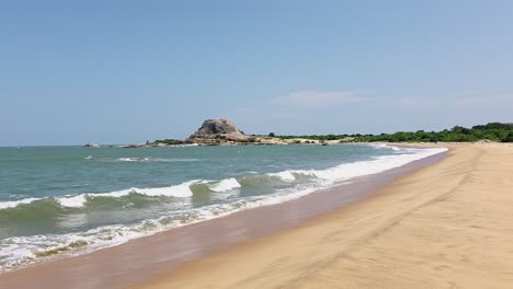 indian ocean waves on a sand beach