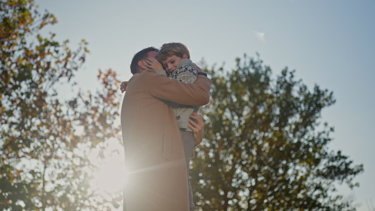 A father and daughter playing together in a park