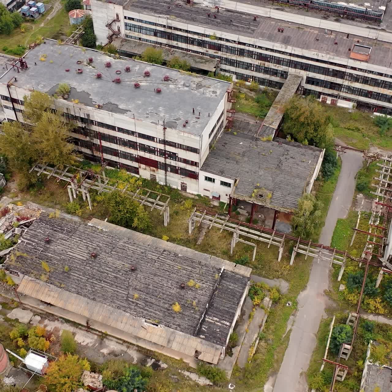 Abandoned ruined factory building architecture. Industrial destroyed city buildings