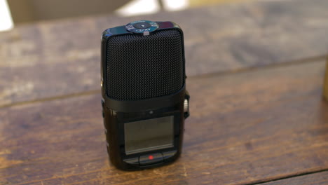 Recording-dictaphone-on-cafe-table