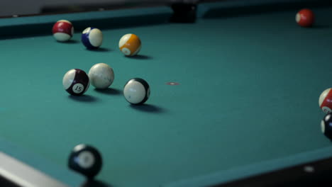 medium close up of golden pool break on billiard table