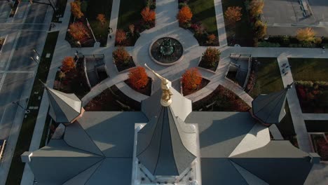 angel moroni golden statue on top of lds mormon temple building in provo, utah - aerial