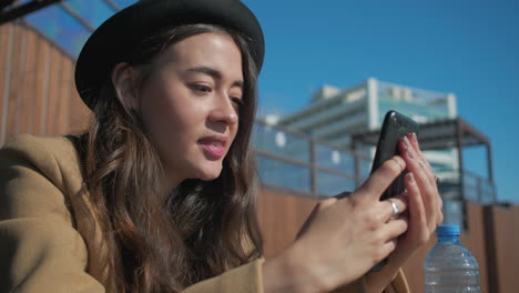 woman using smartphone outdoors