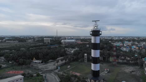 4k aerial view of a lighthouse near the port harbor shot with a drone in pondicherry, india