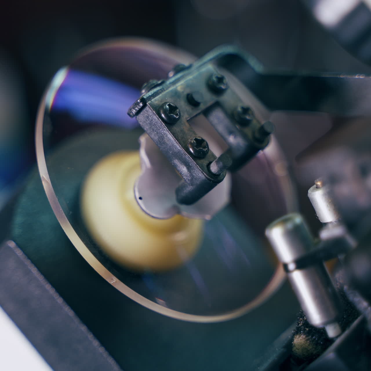 Modern equipment for production of spectacle lenses. Specialist makes eyeglasses in the laboratory. Close-up.