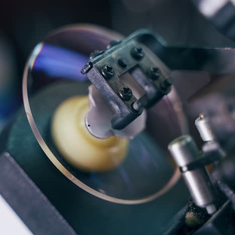 modern equipment for production of spectacle lenses. specialist makes eyeglasses in the laboratory. close-up.
