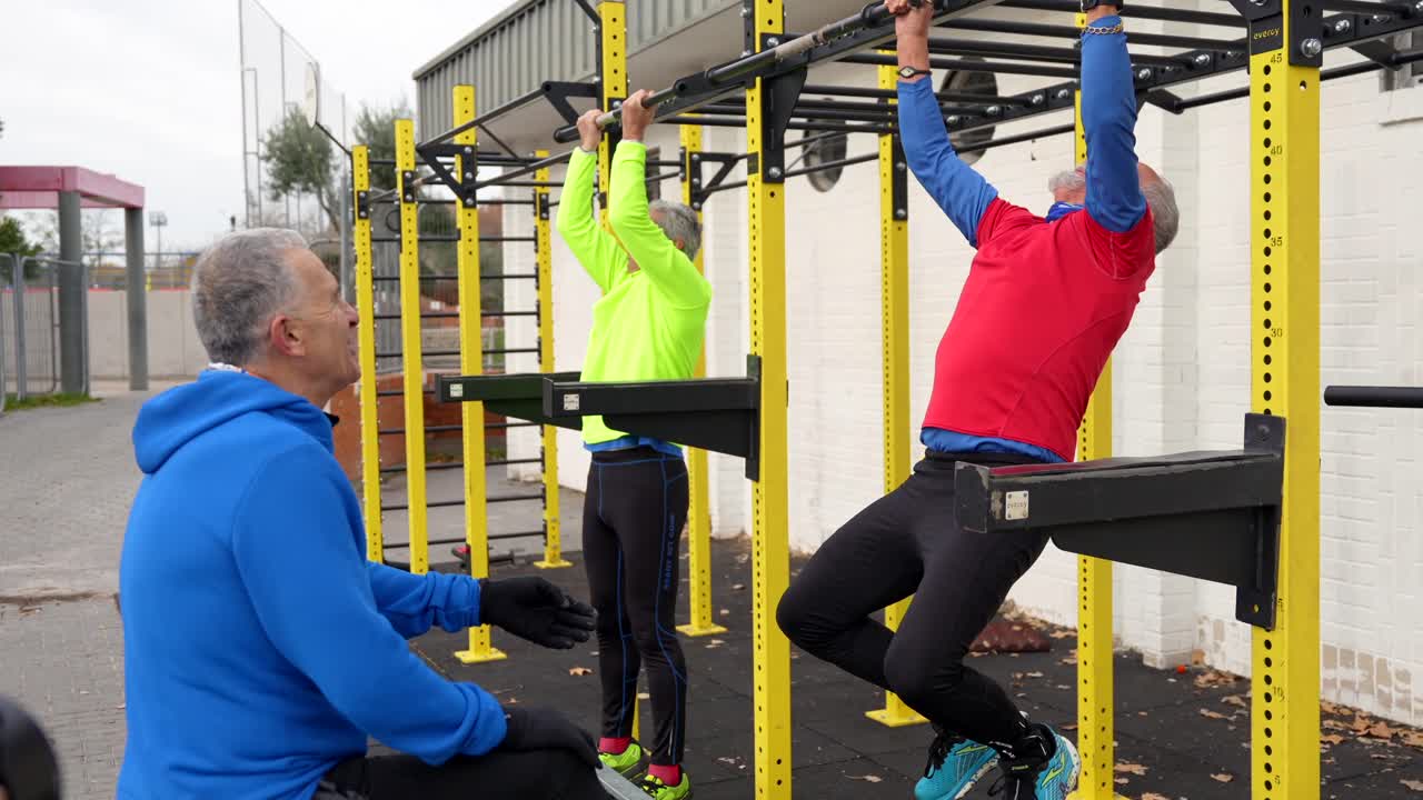 Senior Men Exercising on Pull-Up Bars