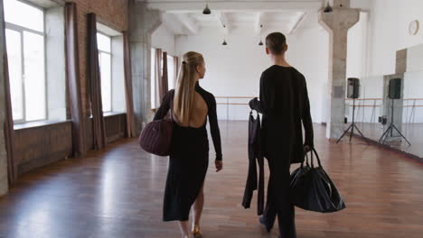 dancers walking into a dance studio
