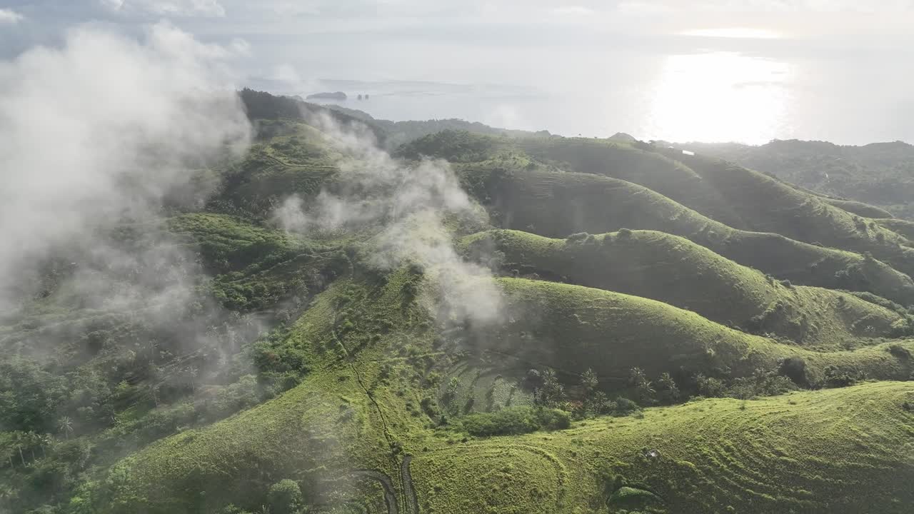Green hills with fog in the foreground - Indonesia - Nusa Penida Island