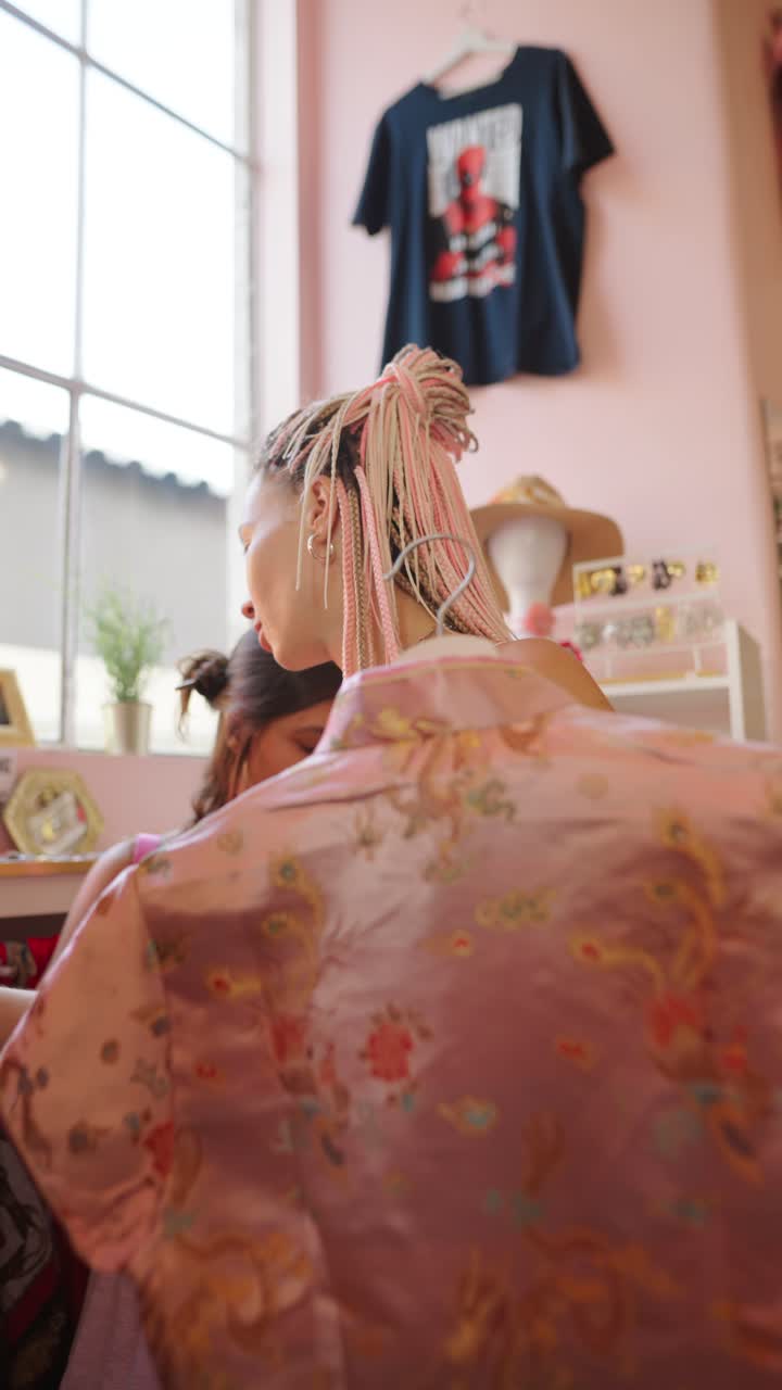 Two women shopping in a clothing store