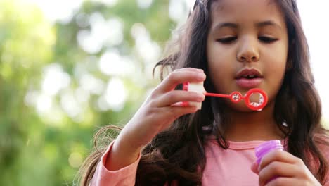 Girl-blowing-soap-bubbles