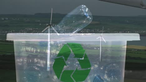 animación de un cartel de reciclaje verde sobre una caja con botellas de plástico y una turbina eólica