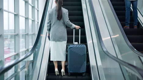 escalator, luggage and business woman