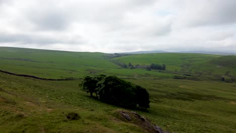 drone footage of peak district national park near whaley bridge, england, uk - showing rolling landscape and few trees on the uplands