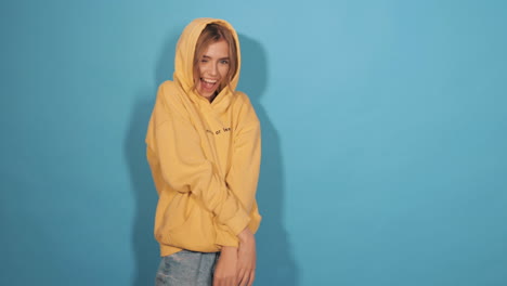 young woman in yellow hoodie