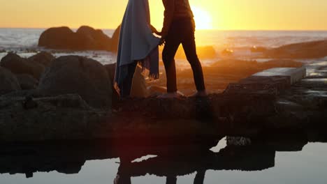 couple kissing on beach near sea 4k