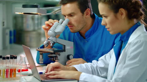 lab doctor teamwork in lab. medical team doing microscope research