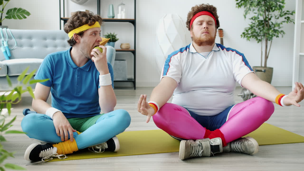 Two Men in Retro Exercise Attire Practicing Yoga at Home