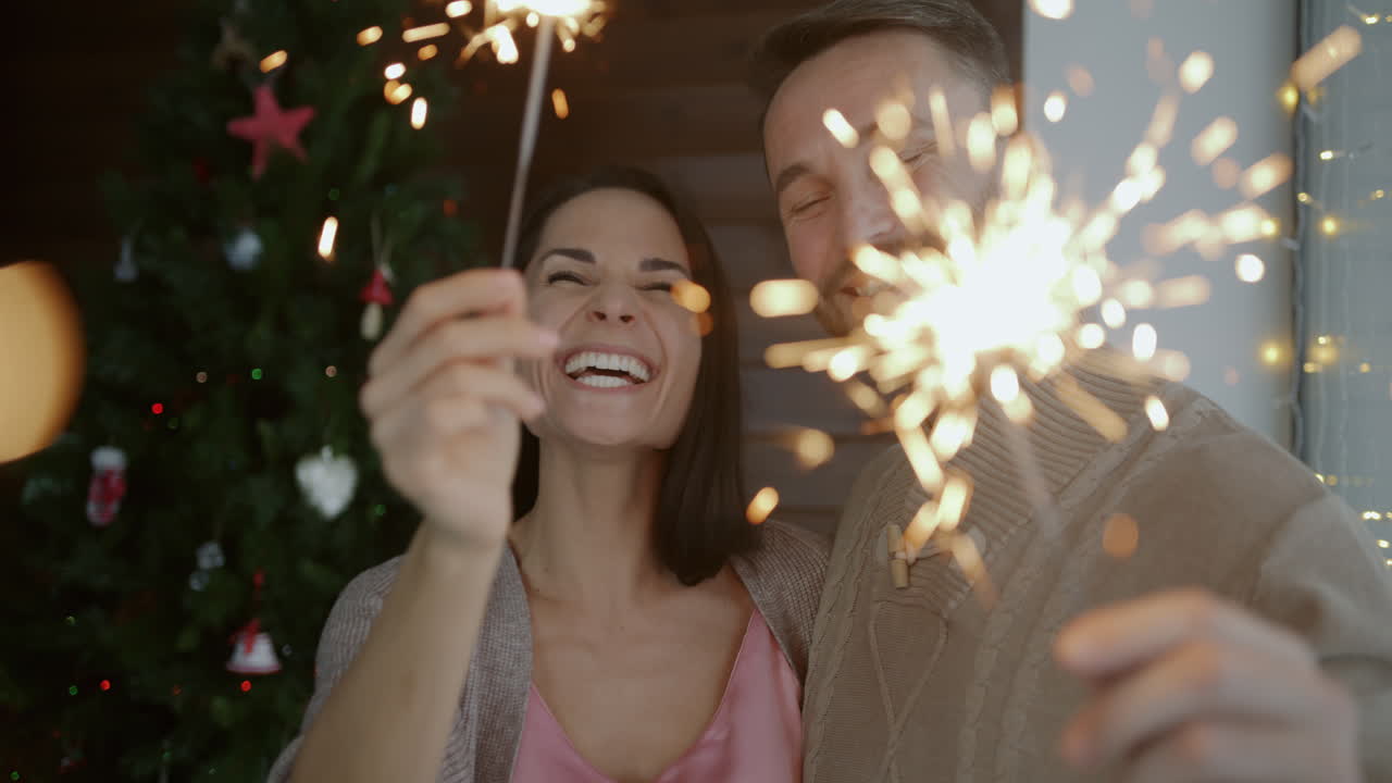 Couple Celebrating Christmas with Sparkles