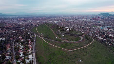 Aerial-orbit-of-the-Calan-hill-in-the-commune-of-Las-Condes,-Santiago,-Chile