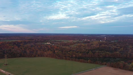 An-aerial-shot-of-Poolesville,-nestled-in-Montgomery-County,-Maryland-during-autumn,-at-sunset