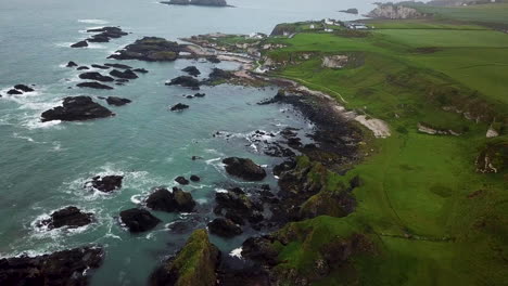 cinematic downward aerial view of rocky coastline in northern ireland