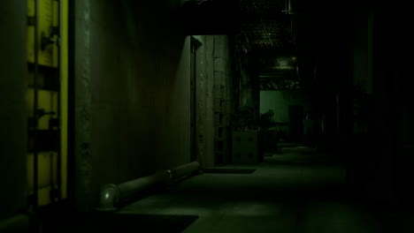 dimly lit corridor in an industrial setting shrouded in shadows