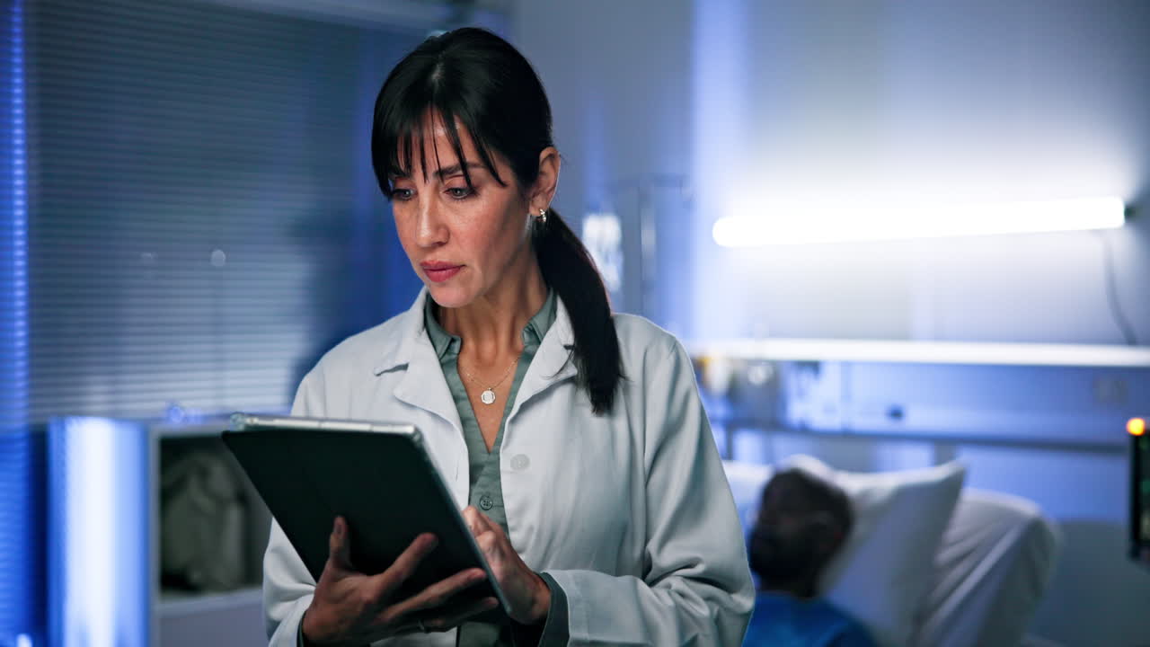 Doctor Using Tablet in Hospital Room