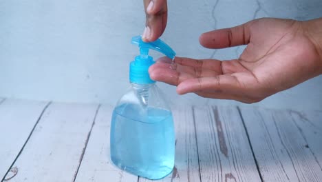 applying hand sanitizer